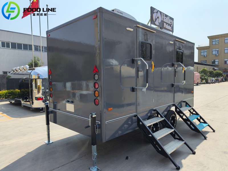 grey mobile toilet trailer